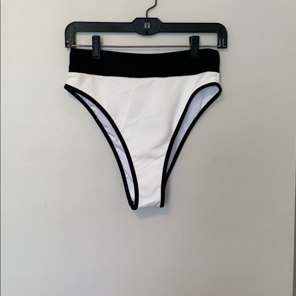 High waisted white and black bathing suit bottoms.